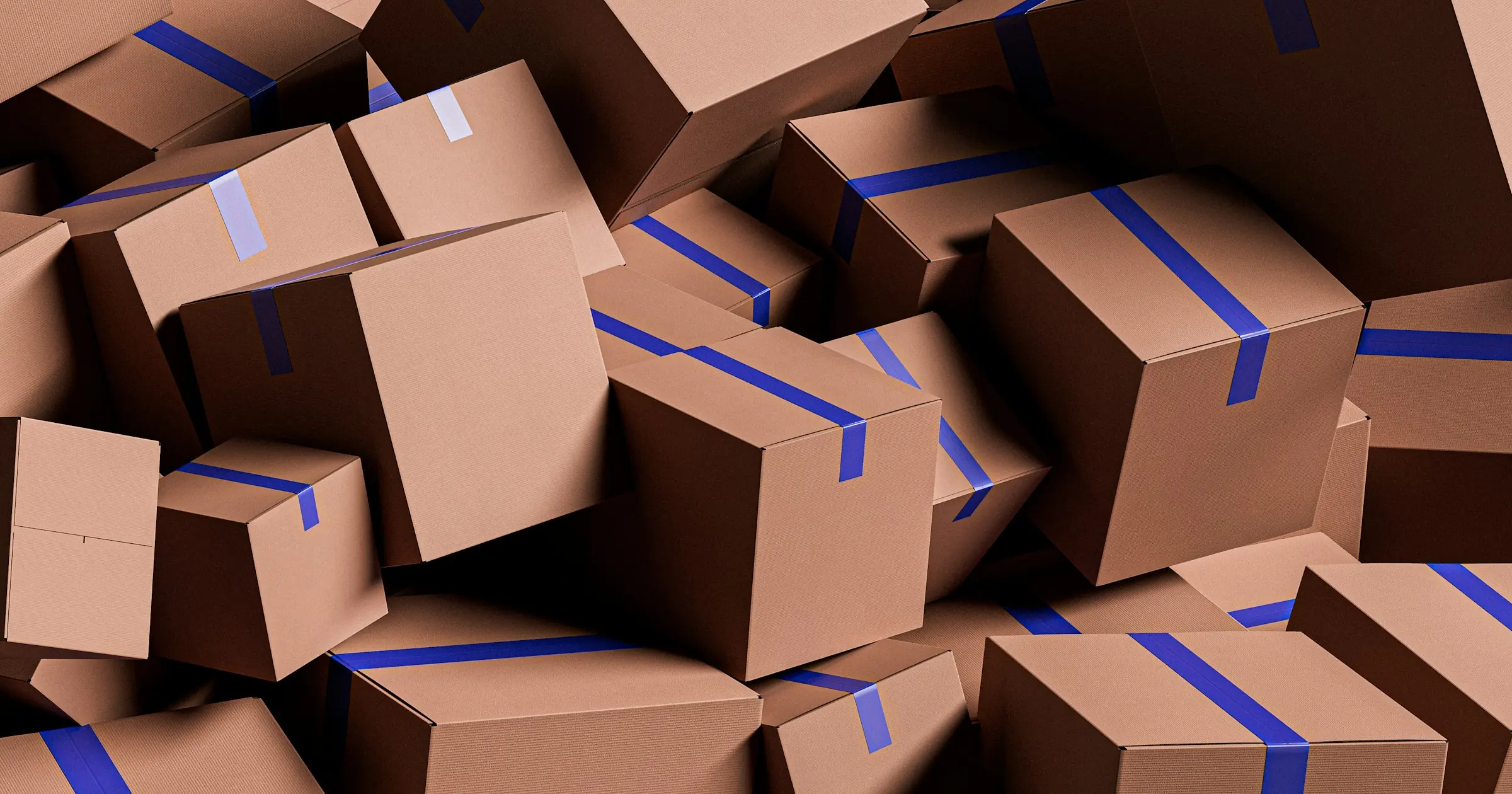 Pile of cardboard boxes sealed with blue tape